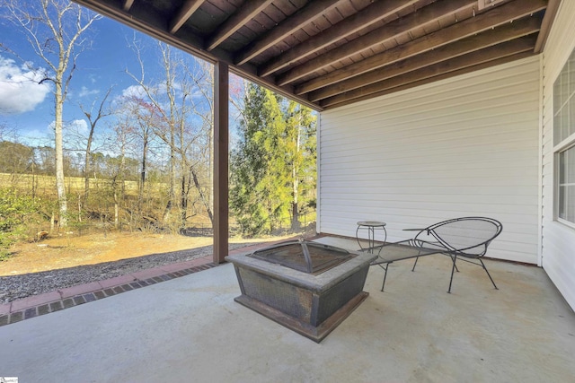 view of patio / terrace featuring an outdoor fire pit