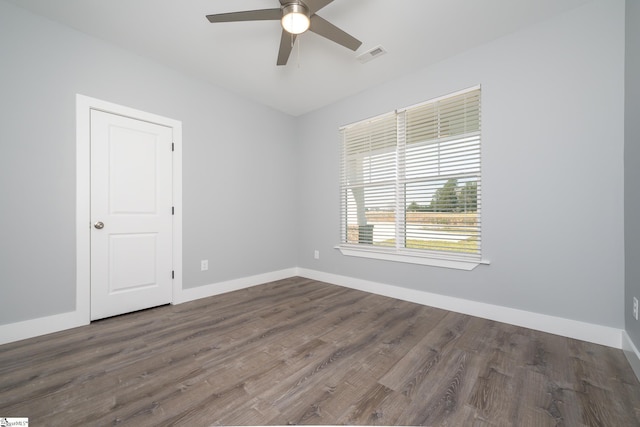 313 Barker Rd, Simpsonville, SC 29680 - spare room featuring visible vents, baseboards, dark wood-type flooring, and ceiling fan