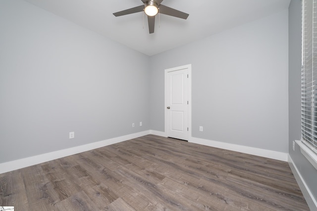 313 Barker Rd, Simpsonville, SC 29680 - unfurnished room featuring dark wood-style floors, baseboards, and a ceiling fan