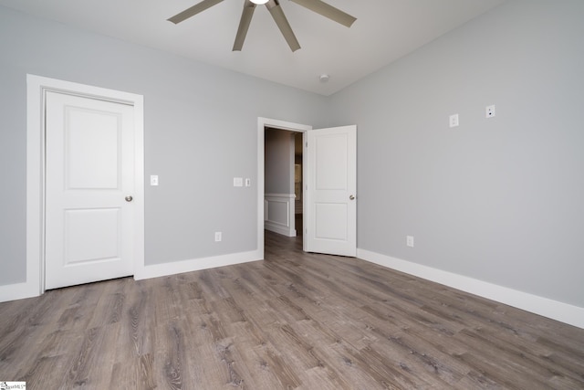 313 Barker Rd, Simpsonville, SC 29680 - unfurnished bedroom featuring ceiling fan, baseboards, and wood finished floors