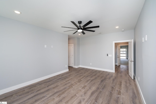 313 Barker Rd, Simpsonville, SC 29680 - unfurnished room with visible vents, wood finished floors, recessed lighting, baseboards, and ceiling fan