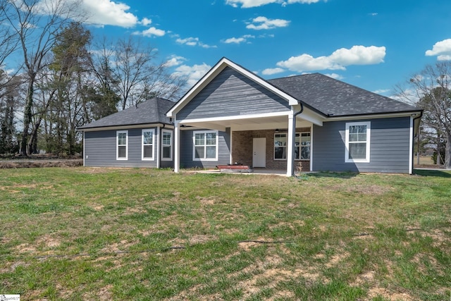 313 Barker Rd, Simpsonville, SC 29680 - view of front of house featuring a shingled roof, a front lawn, and a patio area