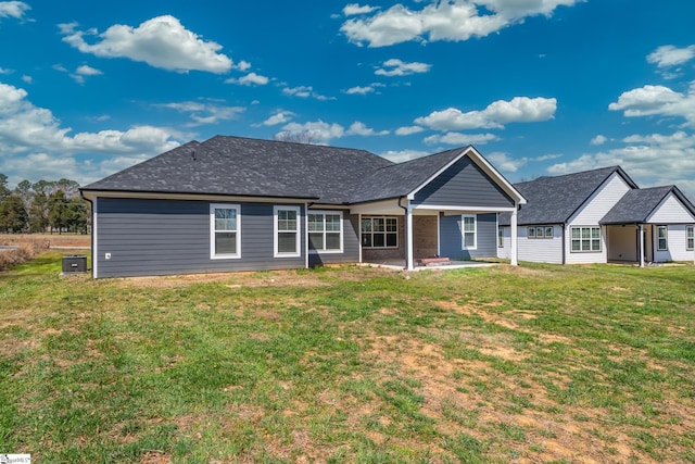 313 Barker Rd, Simpsonville, SC 29680 - back of house with a yard, central air condition unit, roof with shingles, and a patio area