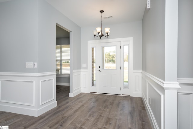 313 Barker Rd, Simpsonville, SC 29680 - entrance foyer with a wainscoted wall, a notable chandelier, wood finished floors, and visible vents