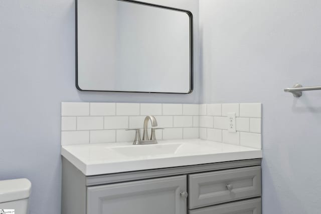 222 Poplar St, Gaffney, SC 29341 - bathroom featuring vanity, toilet, and tasteful backsplash