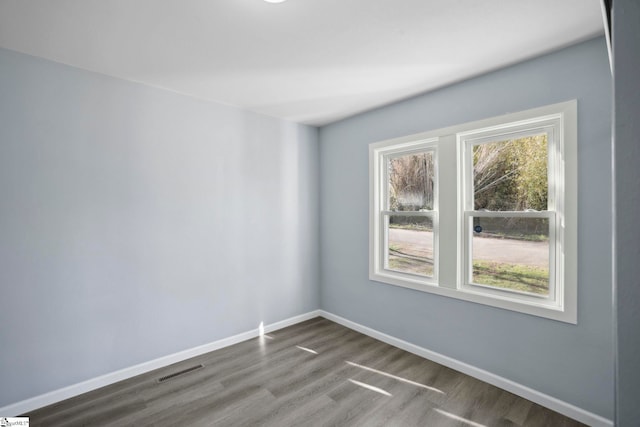 222 Poplar St, Gaffney, SC 29341 - spare room with dark wood-style floors, visible vents, and baseboards