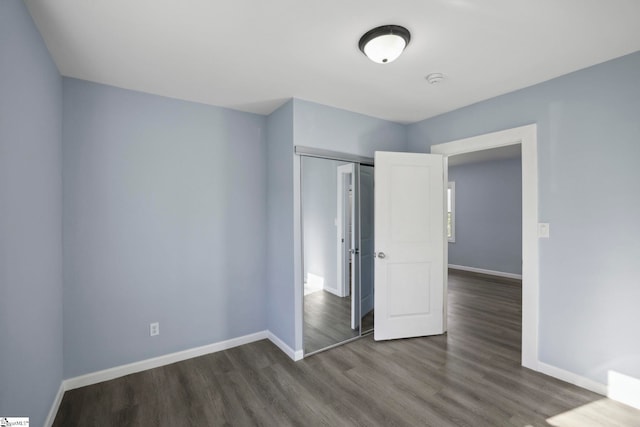 222 Poplar St, Gaffney, SC 29341 - unfurnished bedroom with a closet, baseboards, and wood finished floors