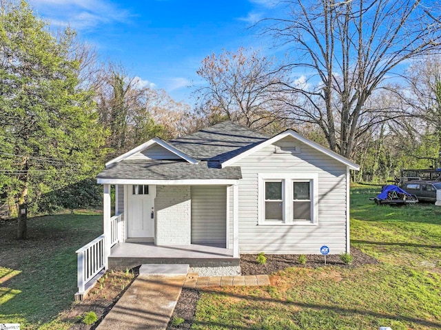 222 Poplar St, Gaffney, SC 29341 - view of front of property featuring covered porch, a front lawn, and a shingled roof
