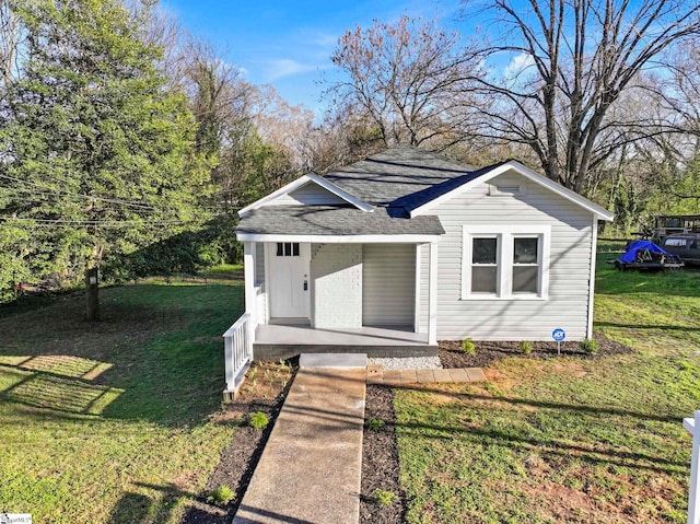 222 Poplar St, Gaffney, SC 29341 - view of front of property featuring roof with shingles, a porch, and a front lawn