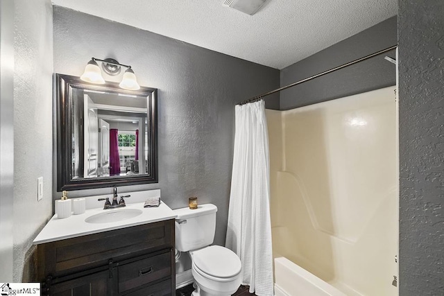 full bath with vanity, visible vents, a textured ceiling, toilet, and a textured wall