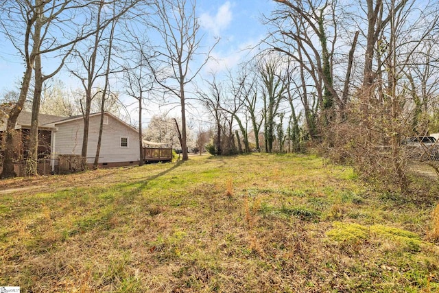 view of yard featuring a wooden deck