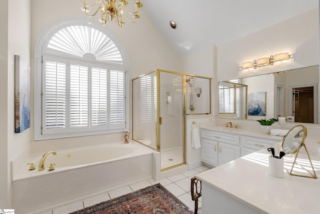 full bathroom featuring tile patterned flooring, a shower stall, an inviting chandelier, a bath, and vanity