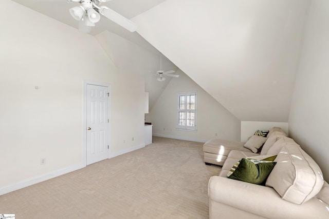 living area featuring vaulted ceiling, a ceiling fan, baseboards, and light carpet