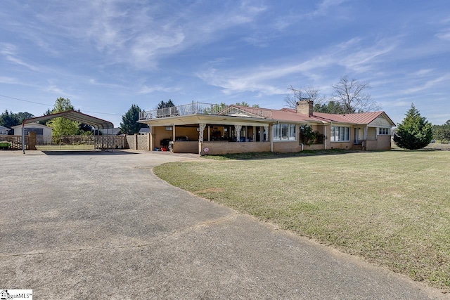 129 Canty Way, Gaffney, SC 29341 - single story home featuring a detached carport, fence, driveway, a chimney, and a front lawn