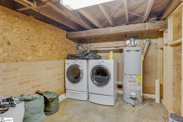 129 Canty Way, Gaffney, SC 29341 - washroom featuring gas water heater, brick wall, washing machine and dryer, and laundry area