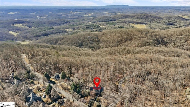 aerial view featuring a view of trees