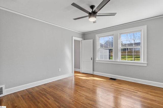 510 N Franklin Rd, Greenville, SC 29609 - unfurnished room with visible vents, baseboards, ceiling fan, and wood finished floors