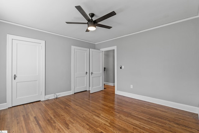 510 N Franklin Rd, Greenville, SC 29609 - unfurnished bedroom with ceiling fan, wood finished floors, baseboards, and ornamental molding