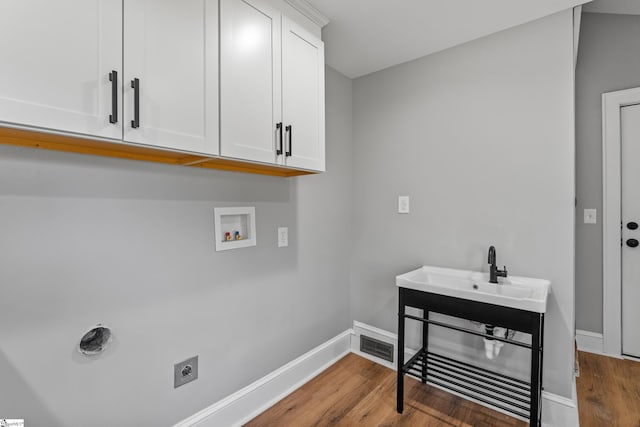 510 N Franklin Rd, Greenville, SC 29609 - laundry room featuring washer hookup, wood finished floors, cabinet space, baseboards, and hookup for an electric dryer