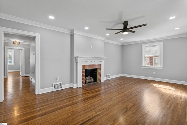 510 N Franklin Rd, Greenville, SC 29609 - unfurnished living room featuring visible vents, ornamental molding, a ceiling fan, hardwood / wood-style flooring, and a brick fireplace