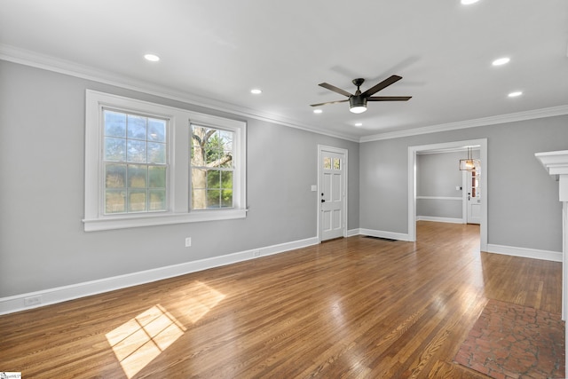 510 N Franklin Rd, Greenville, SC 29609 - unfurnished living room featuring crown molding, baseboards, ceiling fan, recessed lighting, and wood finished floors