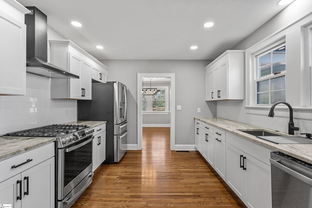 510 N Franklin Rd, Greenville, SC 29609 - kitchen with a sink, stainless steel appliances, white cabinets, and wall chimney range hood