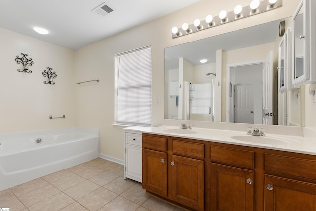 bathroom with a sink, visible vents, a stall shower, and tile patterned flooring