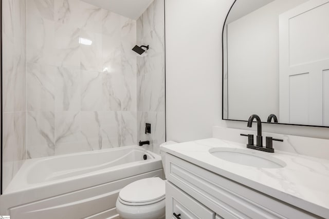 bathroom with tub / shower combination, toilet, and vanity