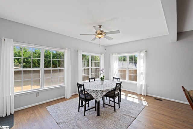 39 Santee Ct, Simpsonville, SC 29680 - dining area with visible vents, baseboards, a ceiling fan, and wood finished floors