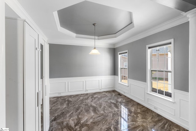39 Santee Ct, Simpsonville, SC 29680 - unfurnished dining area with wainscoting, a decorative wall, marble finish floor, a raised ceiling, and ornate columns