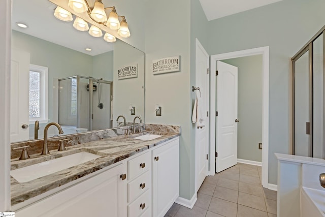 39 Santee Ct, Simpsonville, SC 29680 - full bath featuring a sink, double vanity, a stall shower, and tile patterned floors