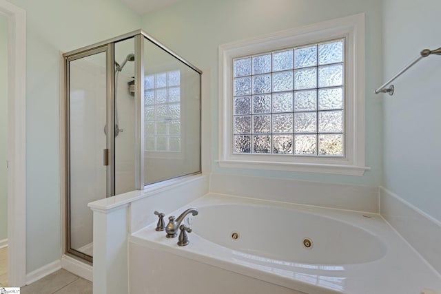 39 Santee Ct, Simpsonville, SC 29680 - full bath with a tub with jets, a stall shower, and tile patterned flooring