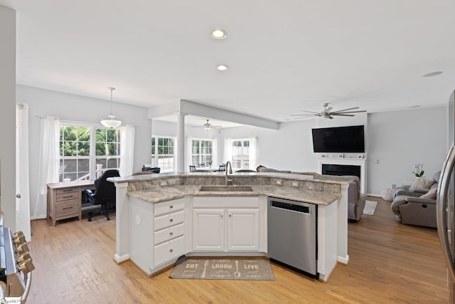 39 Santee Ct, Simpsonville, SC 29680 - kitchen featuring stainless steel dishwasher, ceiling fan, open floor plan, and a sink