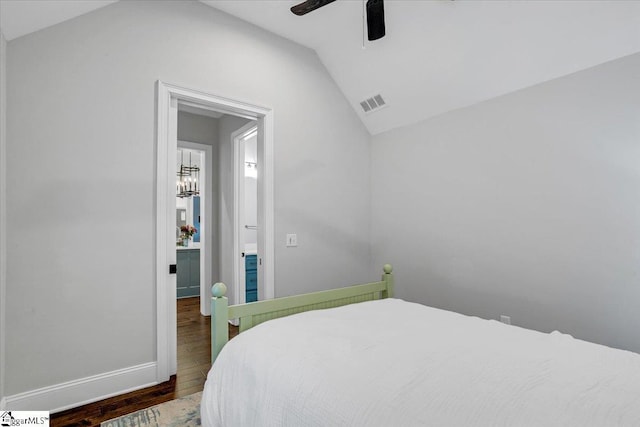 bedroom featuring a ceiling fan, wood finished floors, lofted ceiling, baseboards, and visible vents