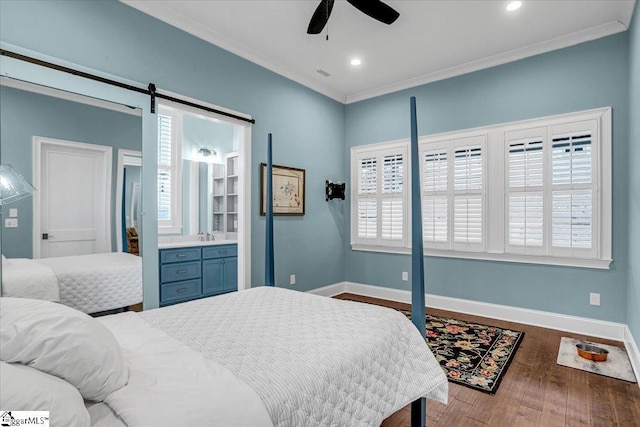 bedroom featuring baseboards, wood finished floors, multiple windows, and crown molding