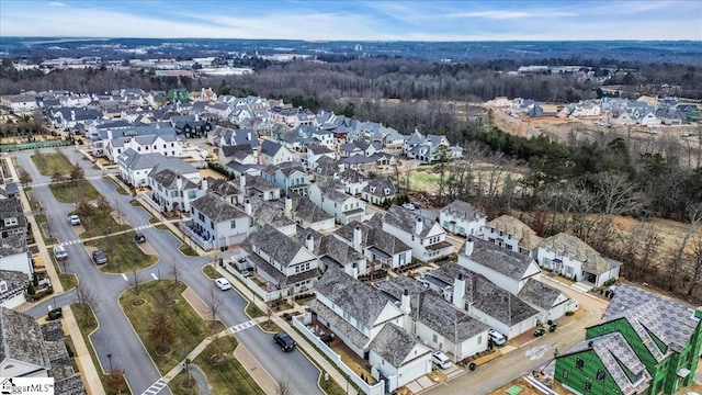 birds eye view of property with a residential view