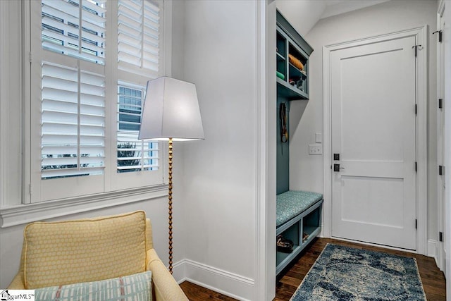 mudroom with dark wood-style floors and baseboards