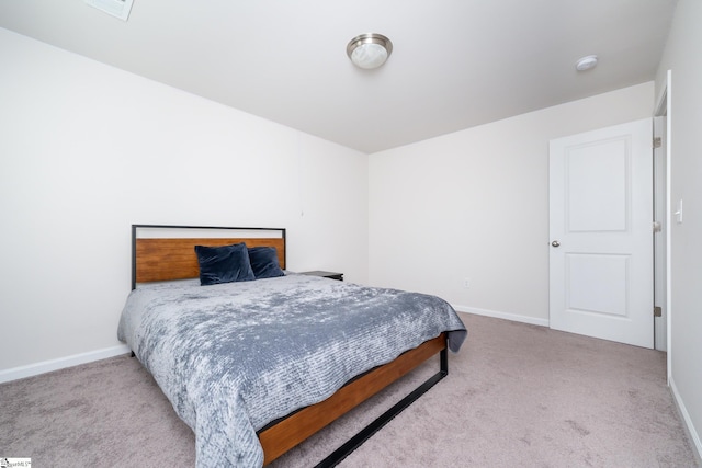 carpeted bedroom with baseboards