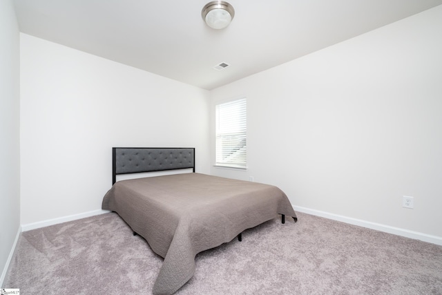 bedroom with visible vents, baseboards, and carpet floors