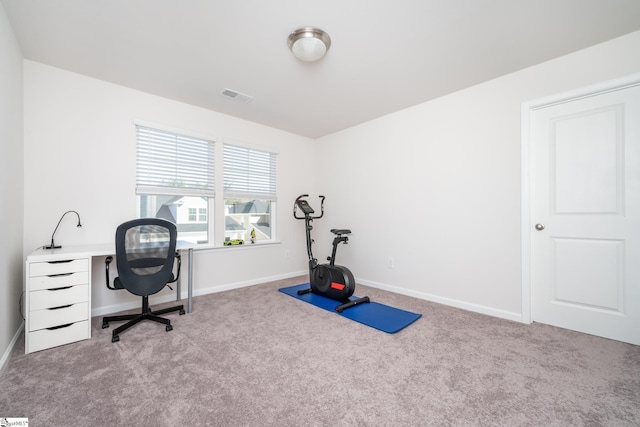 home office with visible vents, baseboards, and carpet flooring