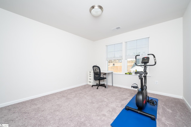workout area featuring visible vents, carpet floors, and baseboards