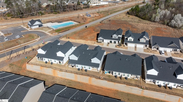 birds eye view of property with a residential view