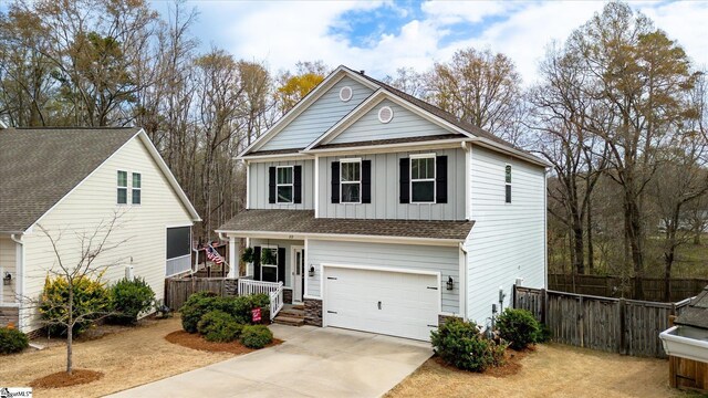212 Donemere Way, Fountain Inn, SC 29644 - traditional-style house with fence, driveway, an attached garage, covered porch, and board and batten siding
