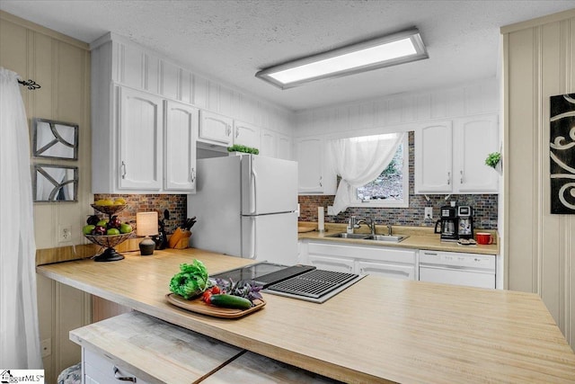 545 Long Reach Dr, Salem, SC 29676 - kitchen featuring tasteful backsplash, a sink, white appliances, a textured ceiling, and white cabinetry