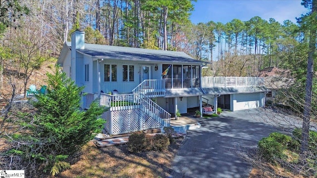 545 Long Reach Dr, Salem, SC 29676 - view of front facade with a chimney, aphalt driveway, stairs, an outbuilding, and a garage