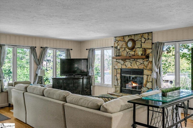 545 Long Reach Dr, Salem, SC 29676 - living area featuring a textured ceiling, wood finished floors, and a fireplace
