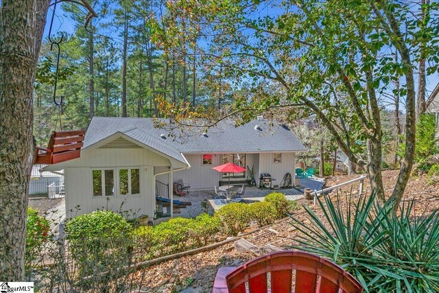 545 Long Reach Dr, Salem, SC 29676 - rear view of house with a patio area, fence, and a shingled roof