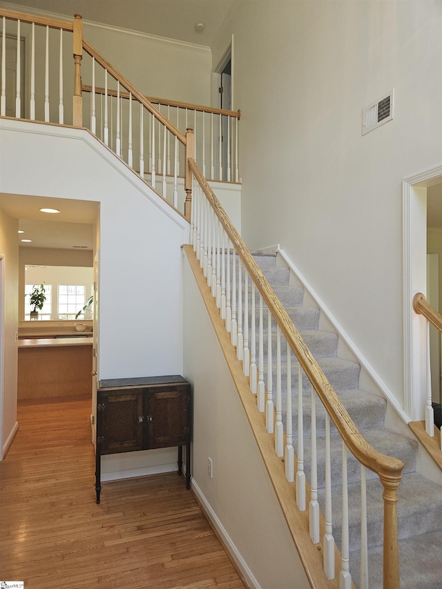 6 Silverthorn Ct, Simpsonville, SC 29681 - stairs featuring a towering ceiling, wood finished floors, and baseboards