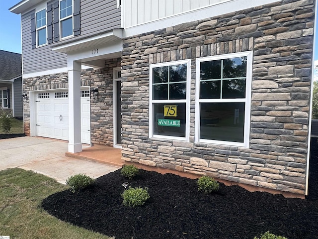 127 Hunter Ridge Dr Lot 75, Boiling Springs, SC 29316 - view of exterior entry featuring an attached garage and stone siding