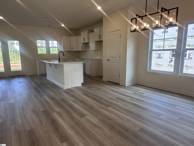 127 Hunter Ridge Dr Lot 75, Boiling Springs, SC 29316 - kitchen with an inviting chandelier, wood finished floors, an island with sink, a sink, and white cabinets
